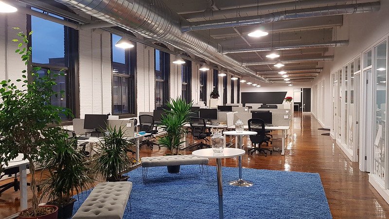 A modern coworking space at Nuage B in Montreal, featuring ergonomic desks, comfortable seating, and a bright, collaborative work environment.